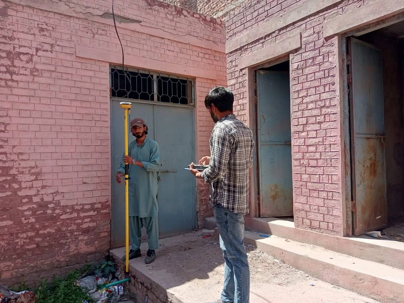 Surveyor measuring land and buildings